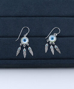 J2-123 BRINCO OLHO GREGO IMPORTADO PESO APROXIMADO 1,1g L18